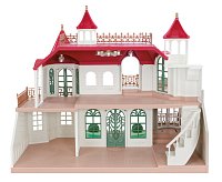 Vila s červenou střechou u řeky