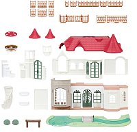 Vila s červenou střechou u řeky